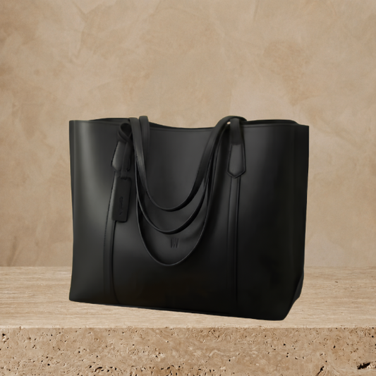 Black leather tote shoulder bag on display